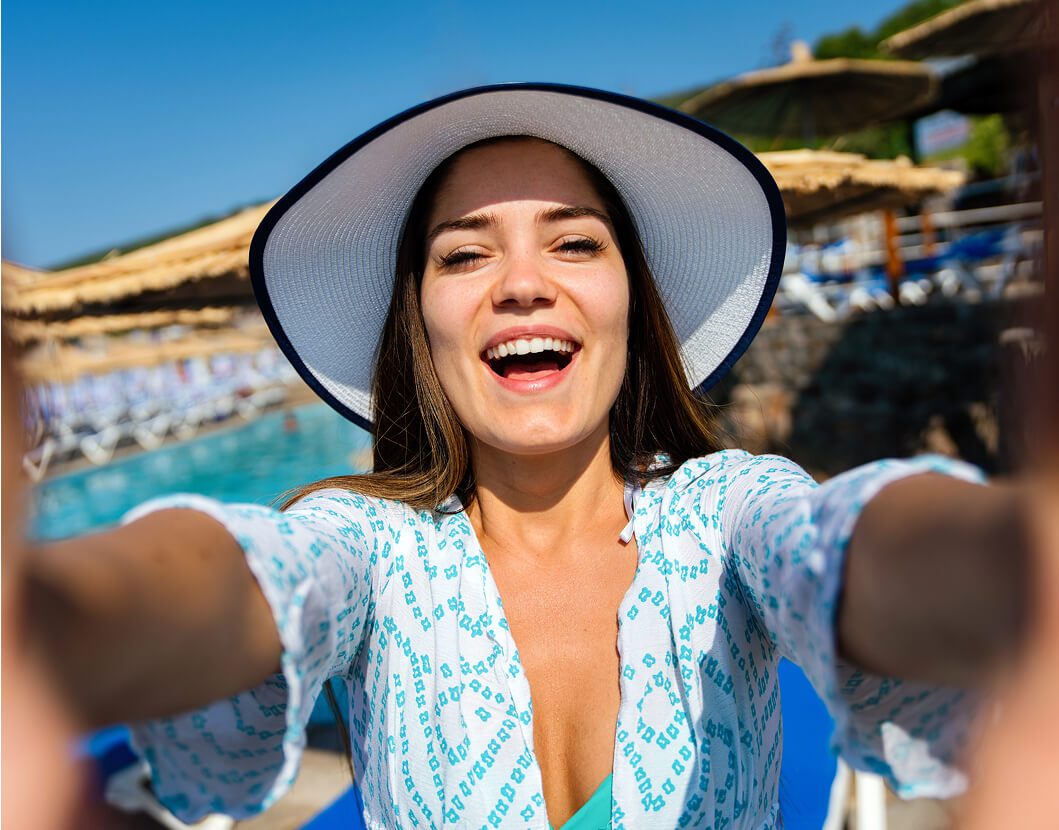 happy-woman-smiling-and-having-fun-at-beach-on-sum-2025-03-13-04-39-57-utc (1)