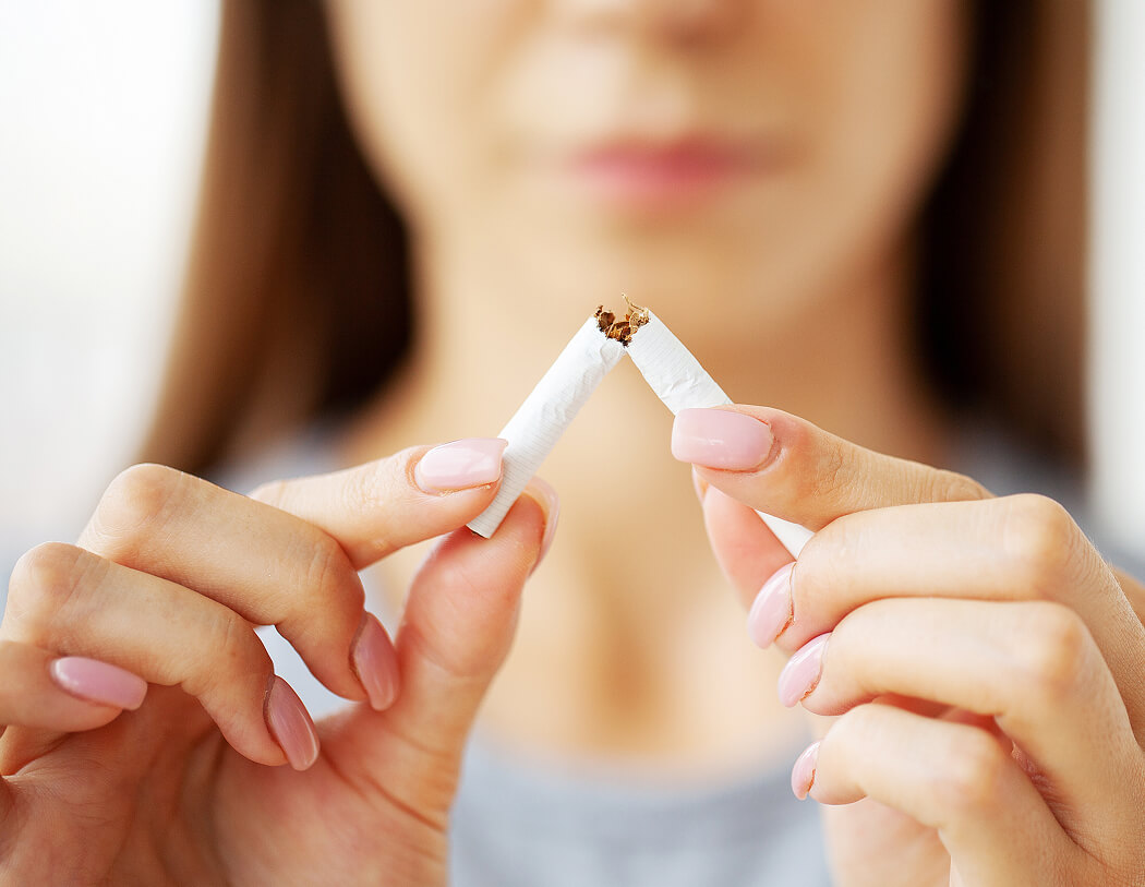 stop-smoking-woman-holding-a-broken-cigarette-2025-02-12-05-50-52-utc (1)